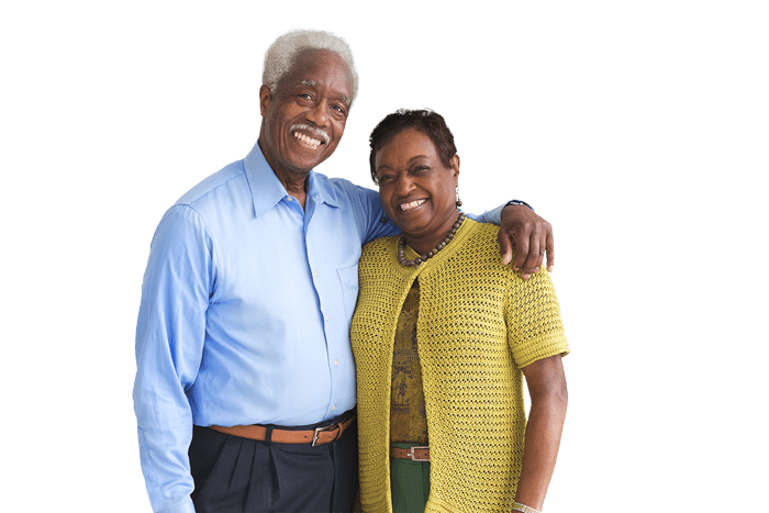 an older couple dressed smartly and smiling